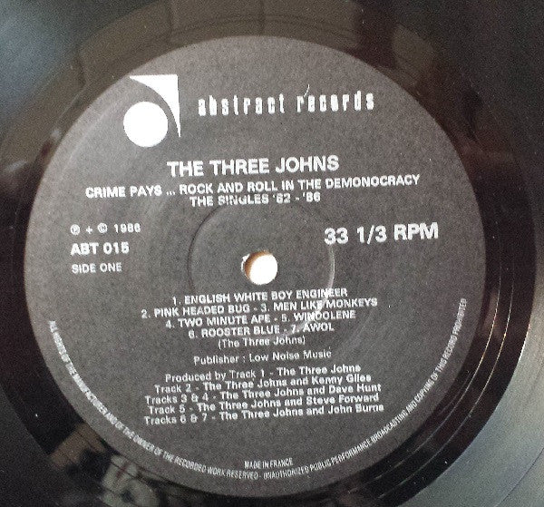 The Three Johns : (Crime Pays…Rock And Roll In The) Demonocracy - The Singles 1982-1986 (LP, Comp)