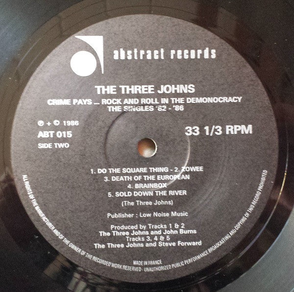 The Three Johns : (Crime Pays…Rock And Roll In The) Demonocracy - The Singles 1982-1986 (LP, Comp)