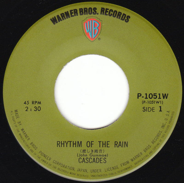 The Cascades (2) = The Cascades (2) : 悲しき雨音 = Rhythm Of The Rain (7", Single, RE, Gre)