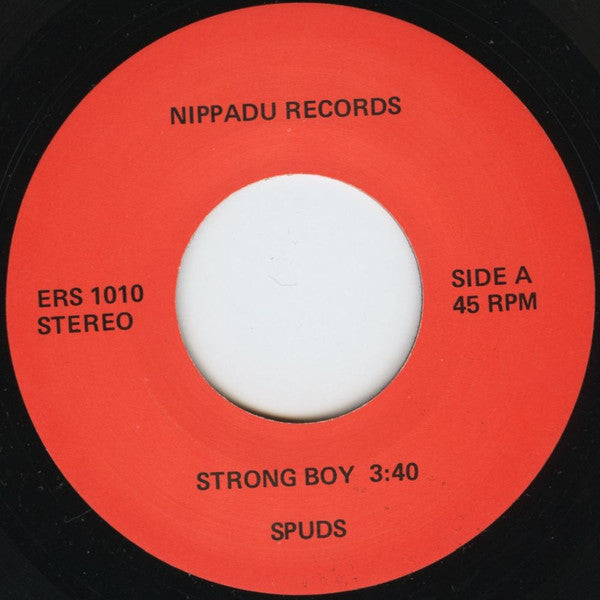 Spuds (3) : Strong Boy / She Sits There Idle (7", Single)