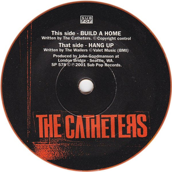 The Catheters : Build A Home (7", Single, Ora)