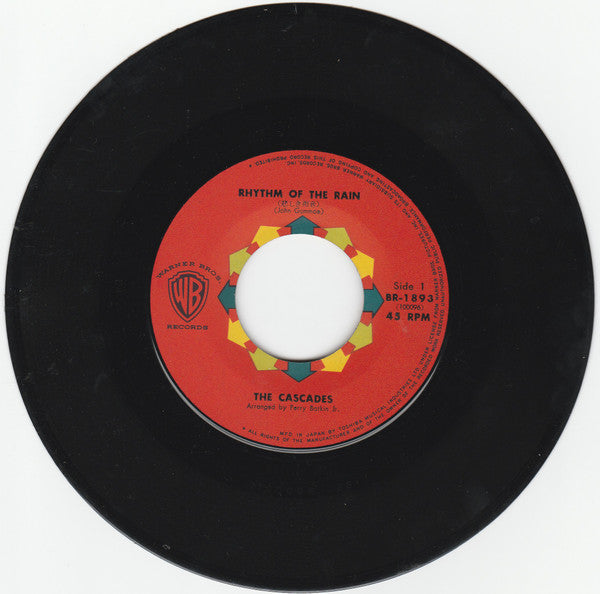 The Cascades (2) : 悲しき雨音 = Rhythm Of The Rain / レット・ミー・ビー = Let Me Be (7", Single, RP, red)