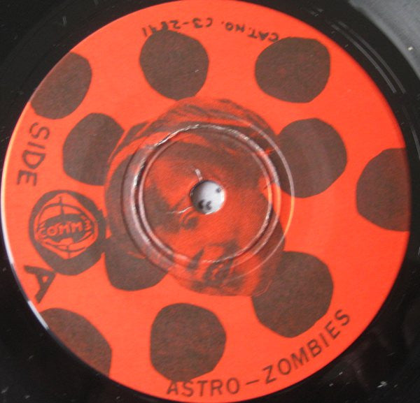 Astro Zombies (2) : The Meat Grinder Of Our Corruption (7", EP)