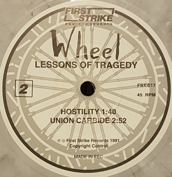 Wheel (4) : Lessons Of Tragedy (7", Ltd, Num, Pea)