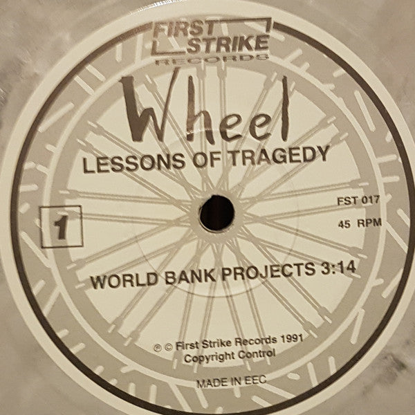 Wheel (4) : Lessons Of Tragedy (7", Ltd, Num, Pea)