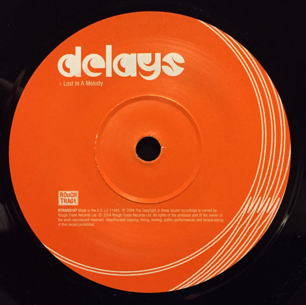 Delays : Lost In A Melody (7", Single)